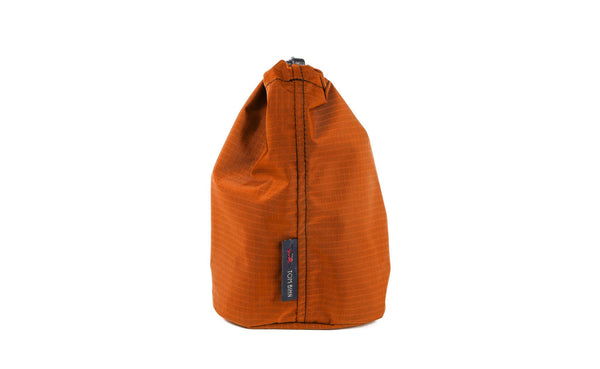 A Size 2 Persimmon (dark orange with orange grid) 210 Cerylon Travel Stuff Sack.